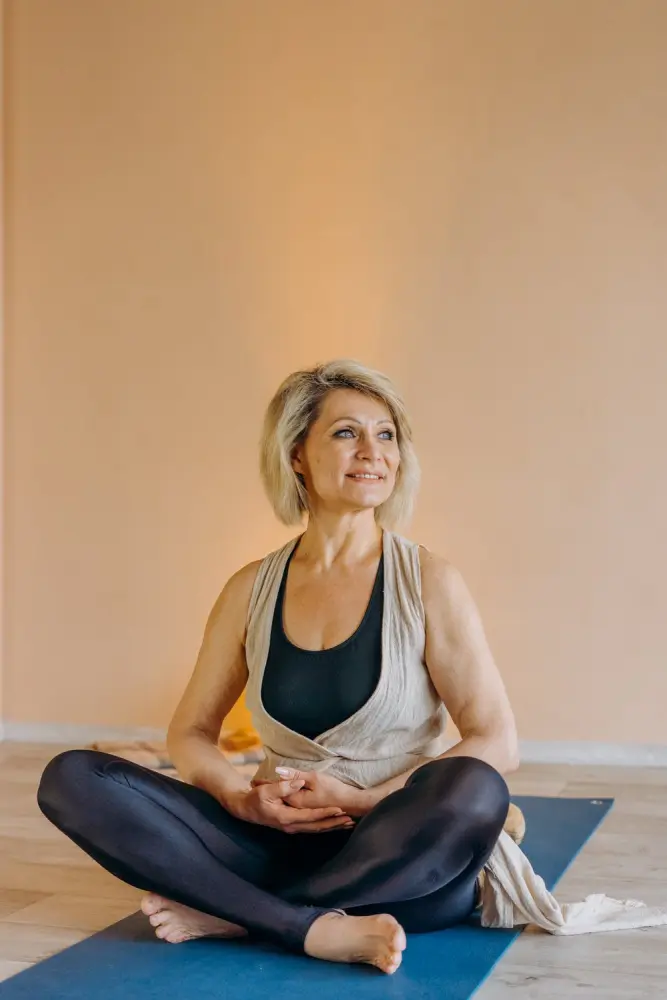 A woman who is happy because medicare covers her chiropractor services.