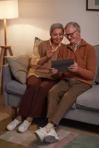 An elderly couple that are happy because they have just signed up for a Medicare Supplement plan.