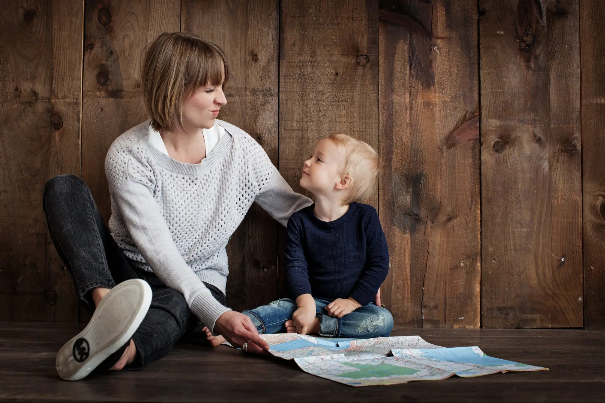 A mother with her child after she has signed her up for Life Insurance.