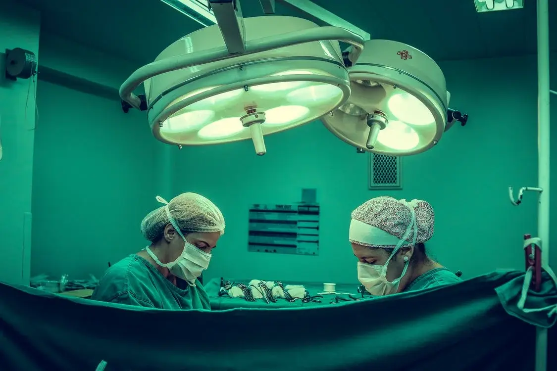 Doctors removing a colon from a patient who has colon cancer.