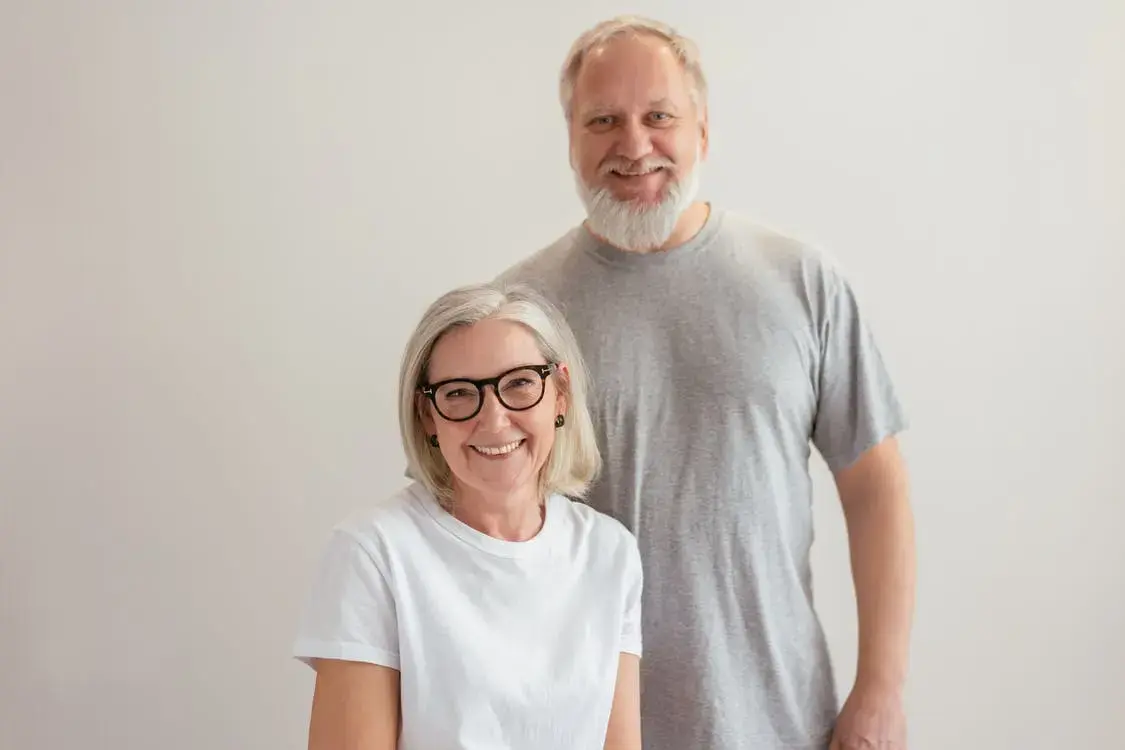 An elderly couple that are happy because they switched to a five star rated Medicare plan.