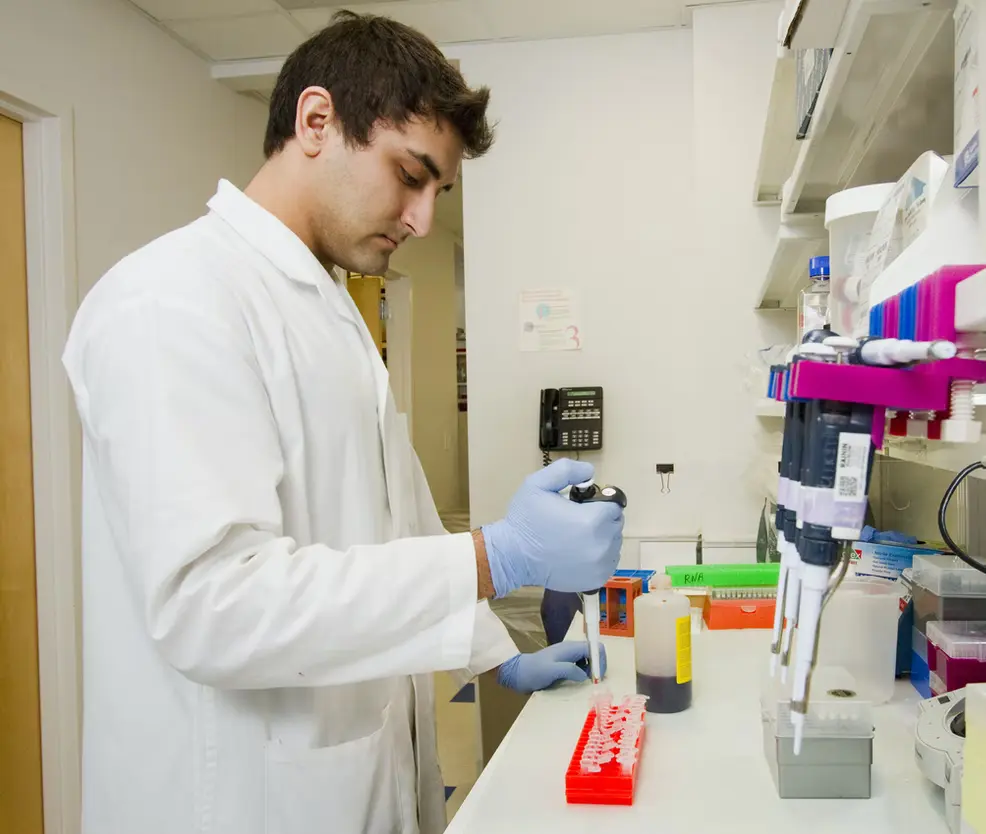 A doctor testing a sample.