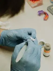 A dentist constructing dentures.