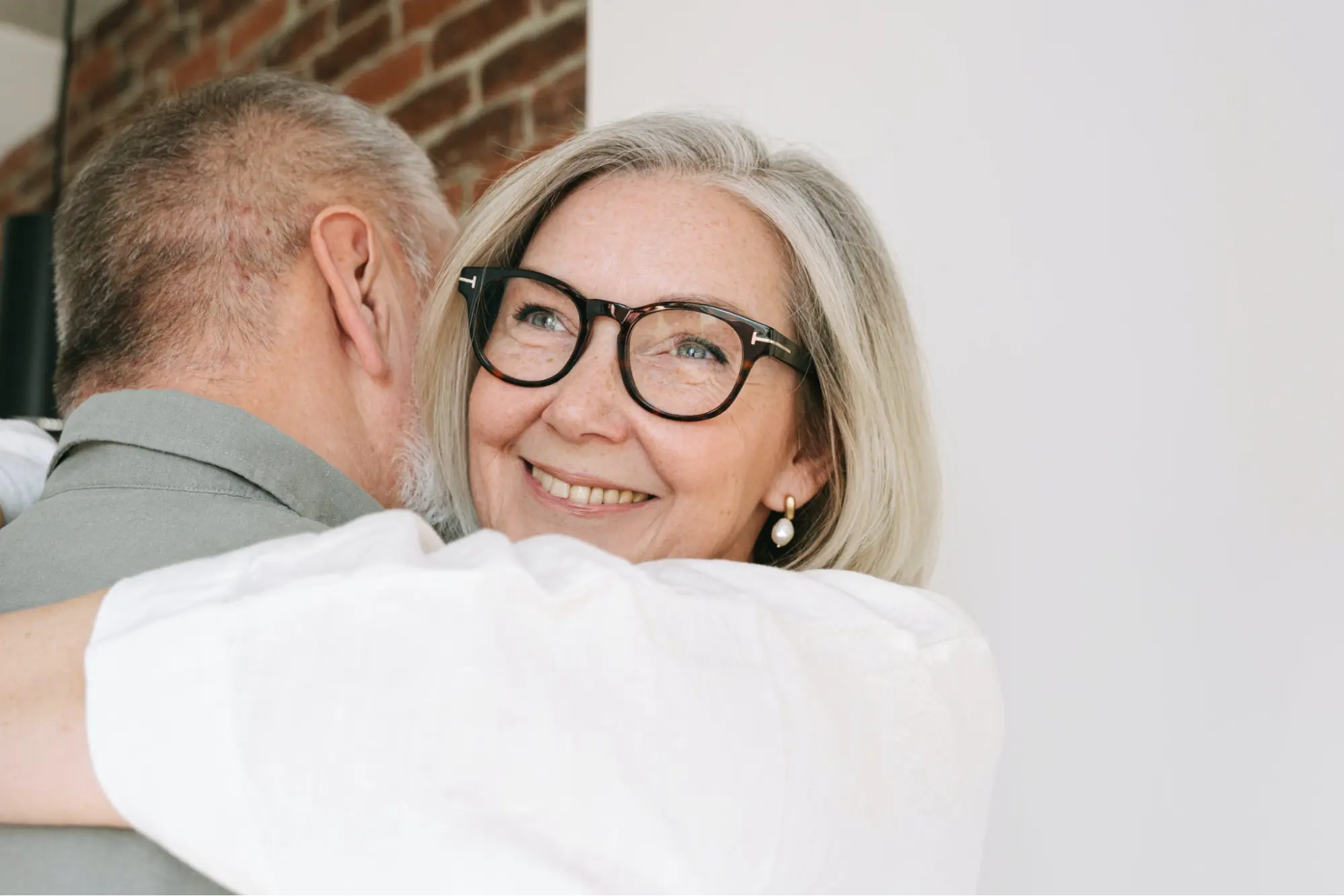 An elderly couple who is happy because some of their other types of therapy are being covered by Medicare.