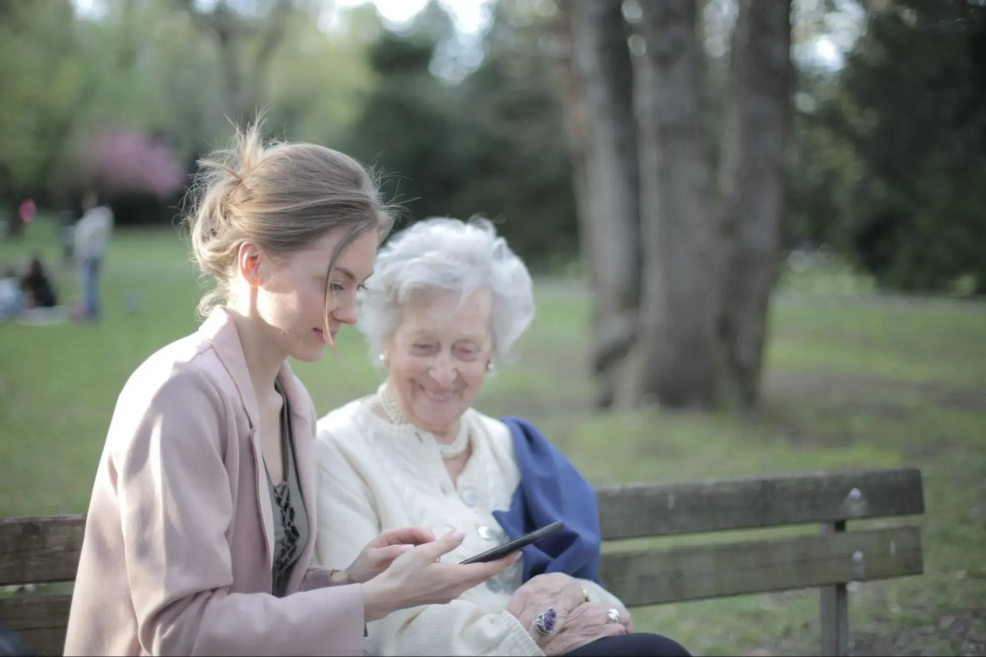 Daughter explaining to her elderly grandmother how to sign up for Dental Insurance.