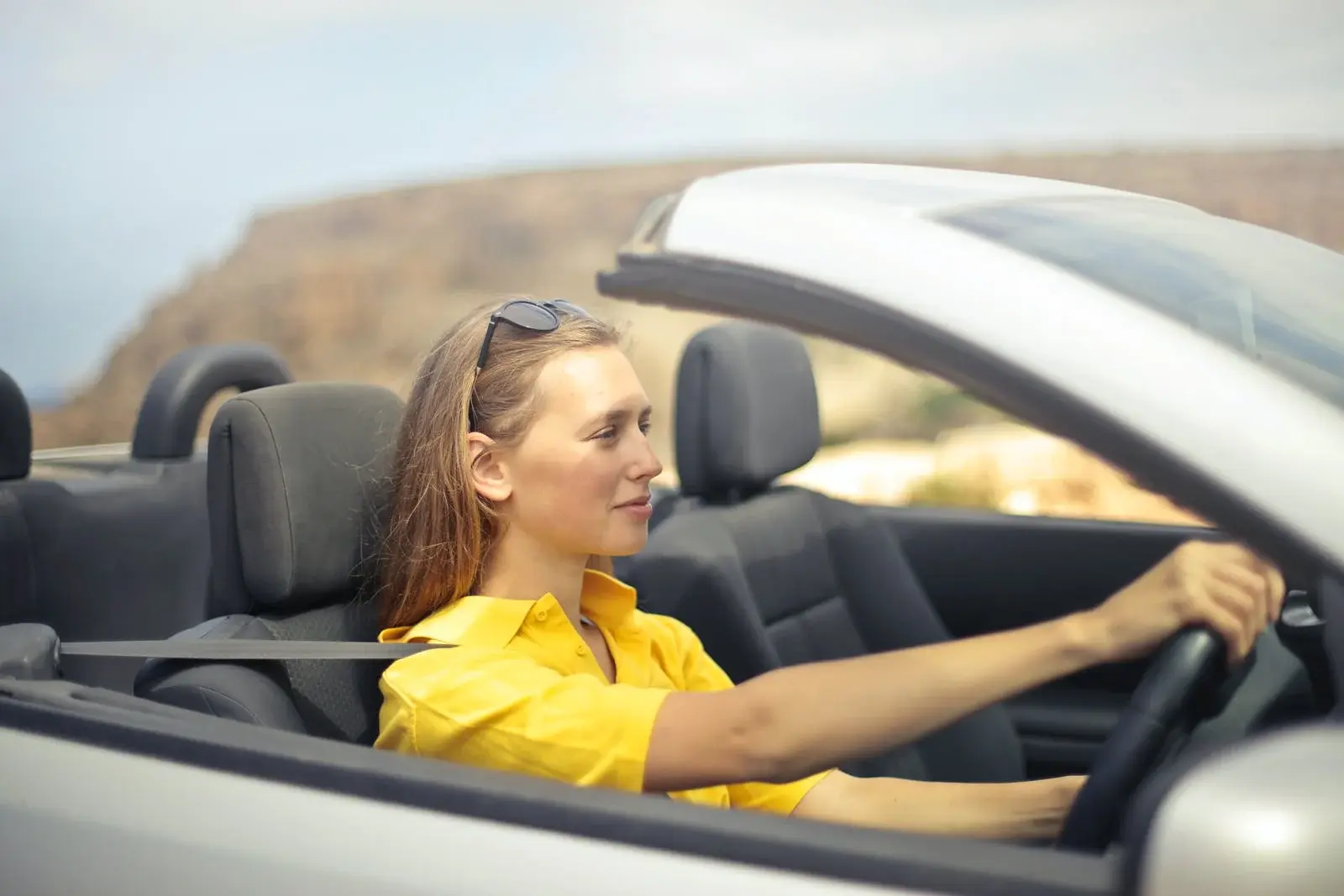 A lady driving peacefully without rage.